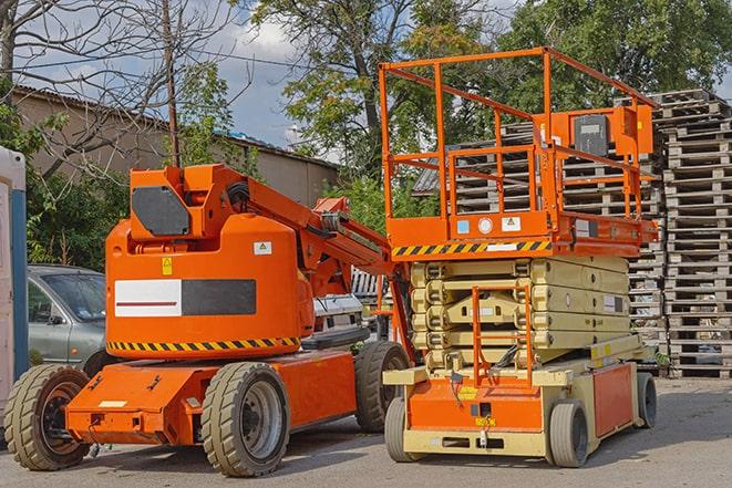 forklift carrying heavy pallets in warehouse in Commerce